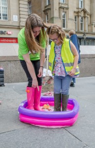 Me and a lovely little girl from the crowd,  got in the pool to demonstrate good welly washing practice and have a bit of a splash about!