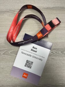 A photo of Ben's name badge and lanyard for Digifest 2023