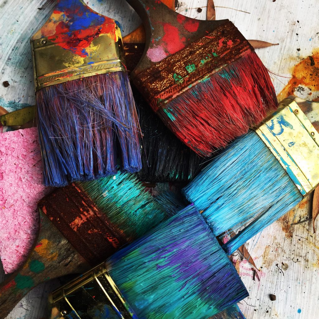 Coloured used paintbrushes