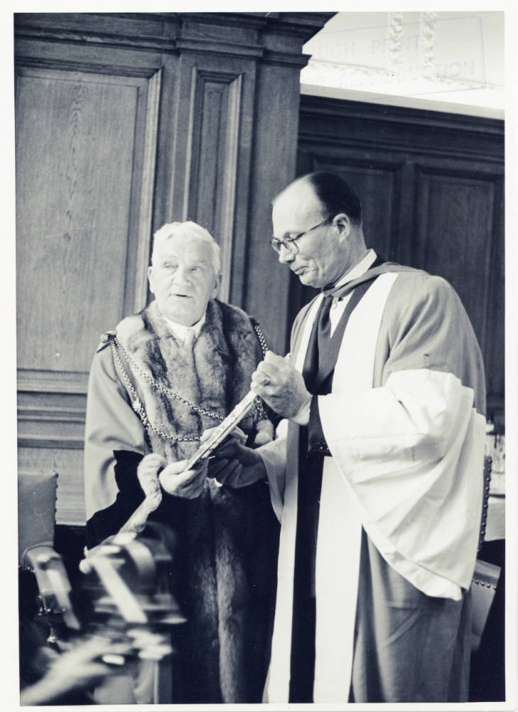 Photograph of The Lord Mayor of Newcastle, Alderman Harry Simm, and The Vice Chancellor of Newcastle University, Dr. C.I.C .Bosanquet, holding the Lindisfarne silver salver presented to the University by the City