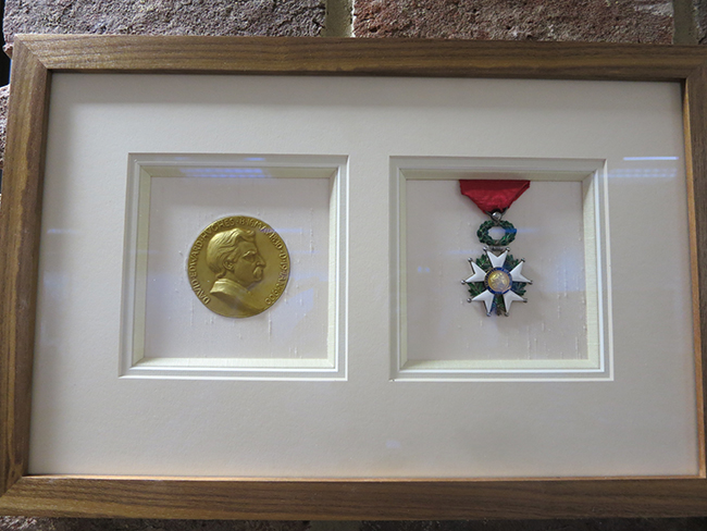 Sir Joseph Swan's, Hughes Medal (left) and Chevalier de la Legion d'Honneur (right). 