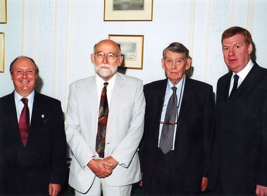 Photograph of  Sir Liam with former Chief Medical Officers of England - (left to right) Sir Kenneth Calman (14th CMO), Sir Donald Acheson (13th CMO), Sir Henry Yellowlees (12th CMO) and Sir Liam Donaldson (15th CMO). 2004