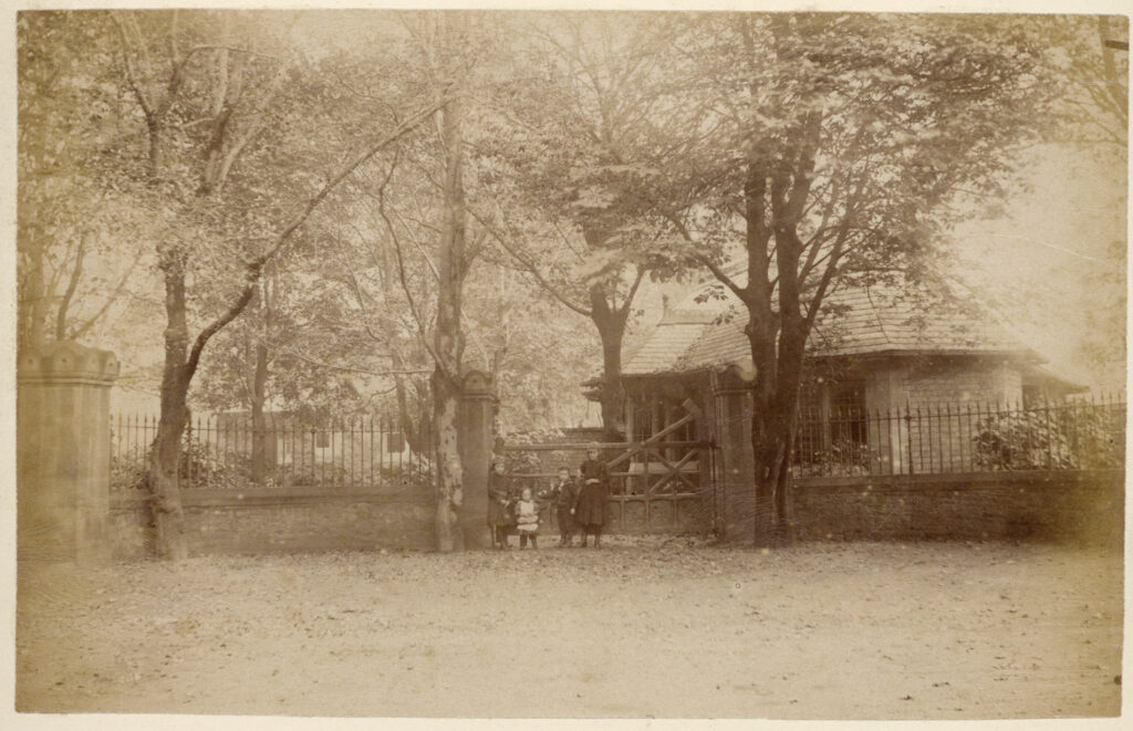 Sepia photograph of Sandyford Road lodge in the snow, c. 1890s